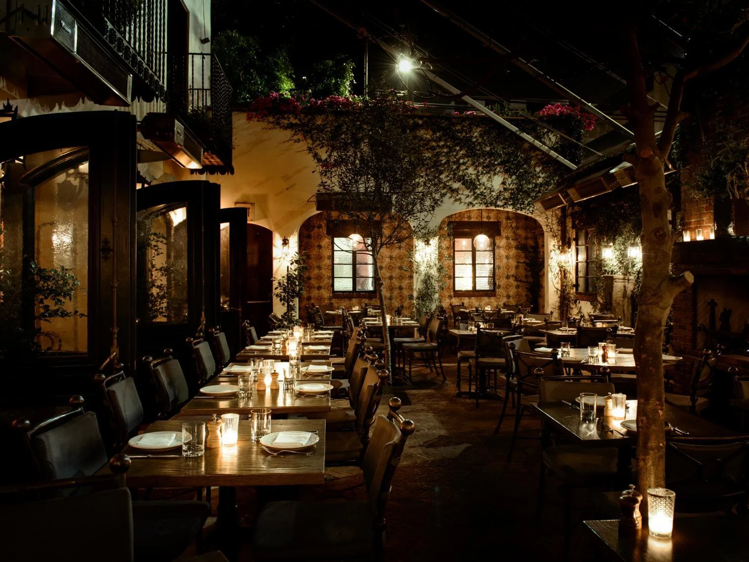 A restaurant dining room with candlelit tables