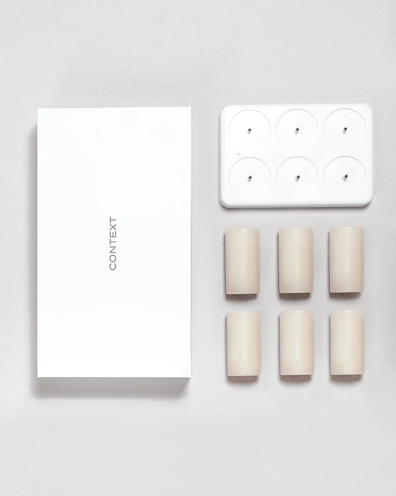 The complete Context set: six wax candles, a USB charging dock and presentation box